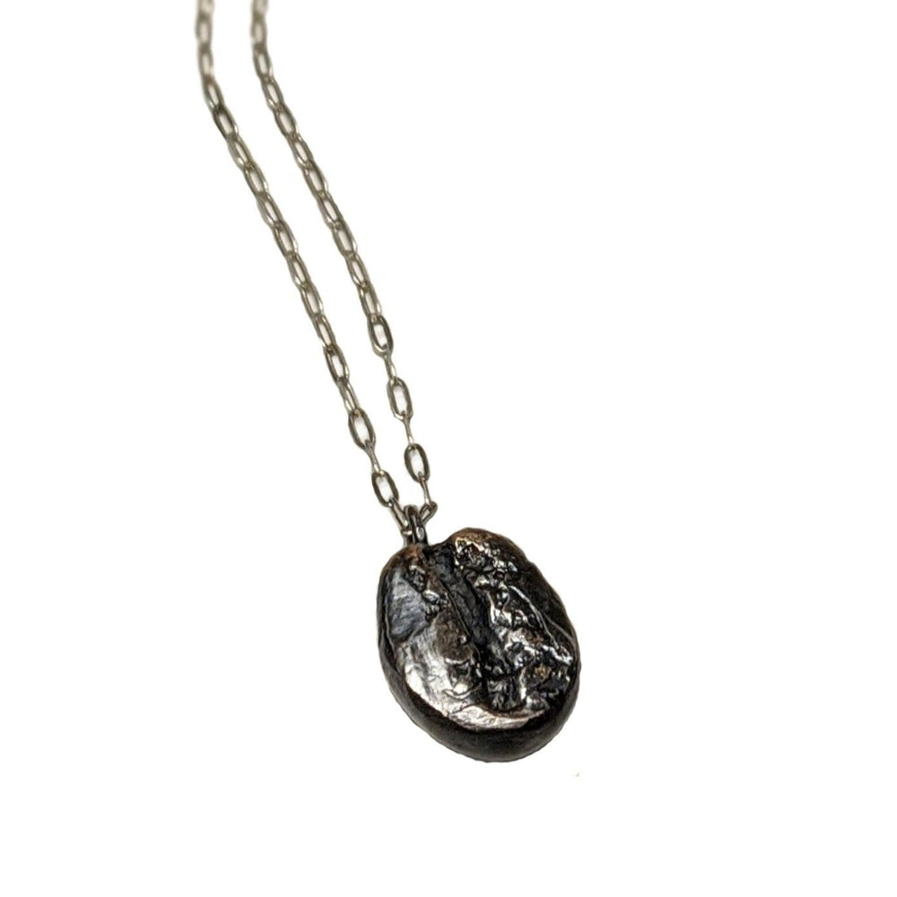 Dark roast coffee bean necklace with a delicate sterling silver chain. Coffee lover's jewelry gift by J'Adorn Designs artist Alison Jefferies