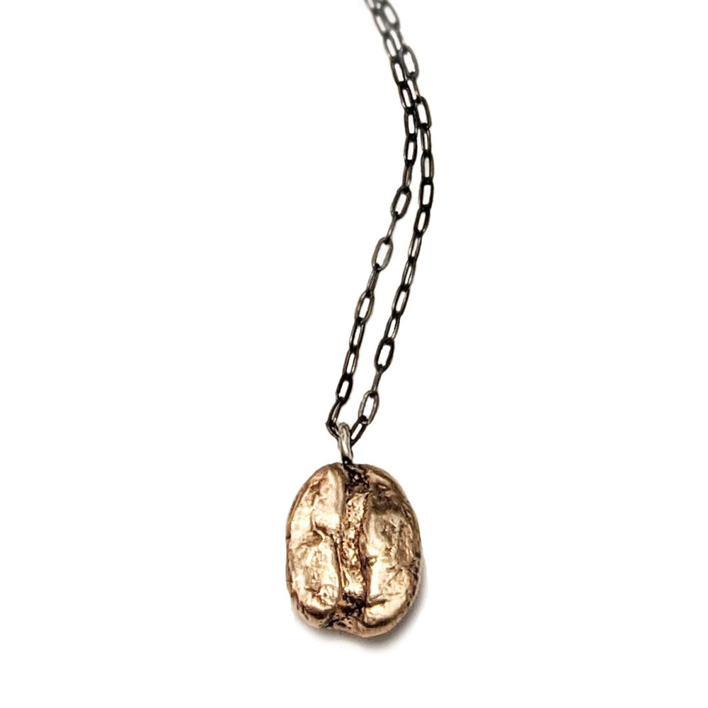 Artisan handcrafted short necklace by J'Adorn Designs artist Alison Jefferies. One bronze cast coffee bean pendant necklace with a black sterling silver chain. Perfect gift for a coffee lover!