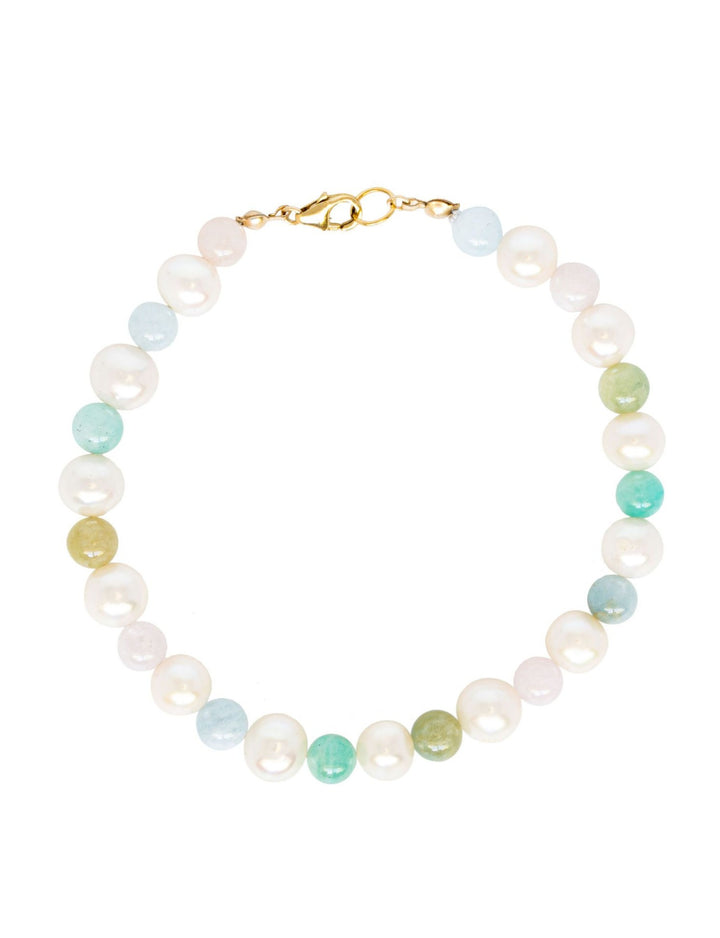 A beautiful rainbow inspired pearl bracelet made with freshwater pearls and multicolored beryl beads with a gold filled clasp. Artisan jewelry by J'Adorn Designs.