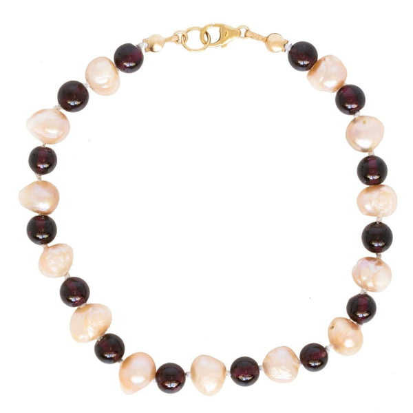 Pink freshwater pearl and garnet bracelet with a 14k gold filled lobster claw clasp. Handcrafted and custom jewelry made by J'Adorn Designs artisan jewelry studio.