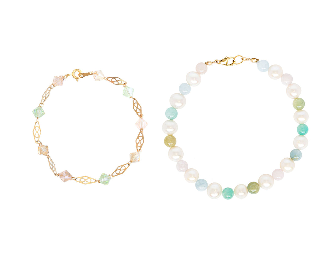 Two beautiful rainbow inspired bracelets featuring light pastel colored beads of freshwater pearls, beryl, and Swarovski crystals. These handcrafted bracelets are gorgeous whether worn together as a jewelry set or separately. Gold bracelets by J'Adorn Designs artisan jewelry.