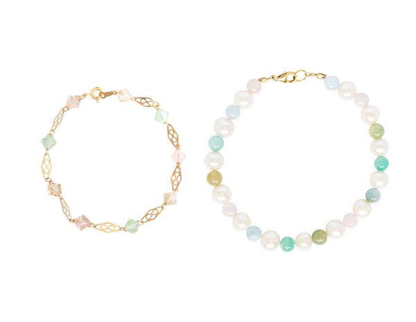 Two beautiful rainbow inspired bracelets featuring light pastel colored beads of freshwater pearls, beryl, and Swarovski crystals. These handcrafted bracelets are gorgeous whether worn together as a jewelry set or separately. Gold bracelets by J'Adorn Designs artisan jewelry.