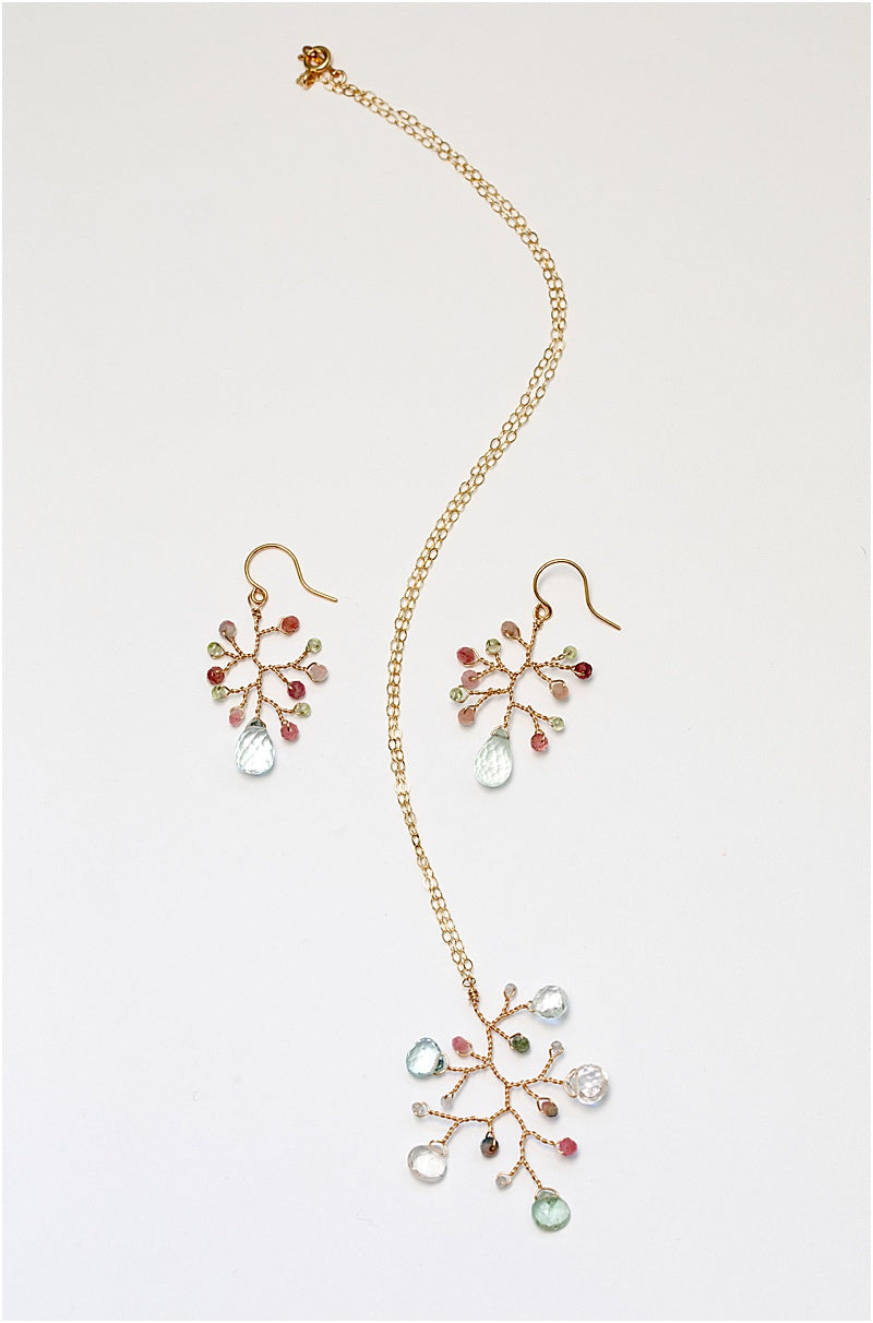 A matching gold jewelry set with handmade earrings and a necklace. For sale: one handcrafted gold pendant featuring a wire-wrapped branch with aquamarine teardrops and tourmaline beads in a rainbow of colors. A lightweight, hypoallergenic gemstone necklace on a fine 14k gold filled chain. Artisan jewelry made by Alison Jefferies for J'Adorn Designs.