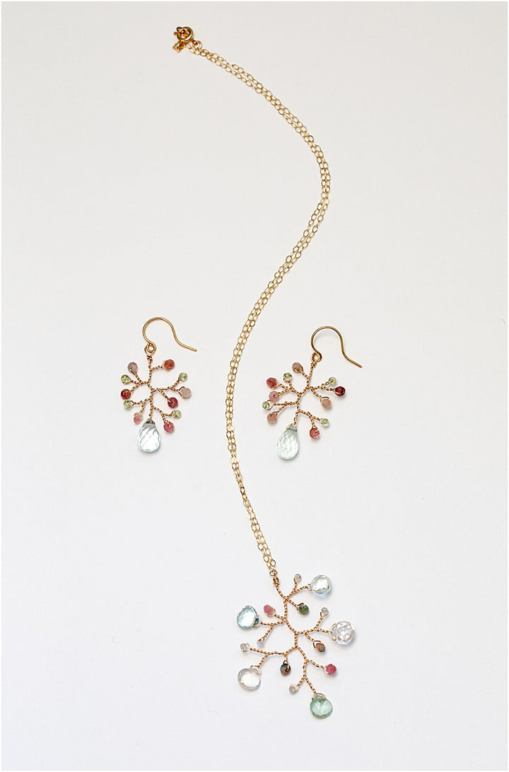 A matching gold jewelry set with handmade earrings and a necklace. For sale: one handcrafted gold pendant featuring a wire-wrapped branch with aquamarine teardrops and tourmaline beads in a rainbow of colors. A lightweight, hypoallergenic gemstone necklace on a fine 14k gold filled chain. Artisan jewelry made by Alison Jefferies for J'Adorn Designs.