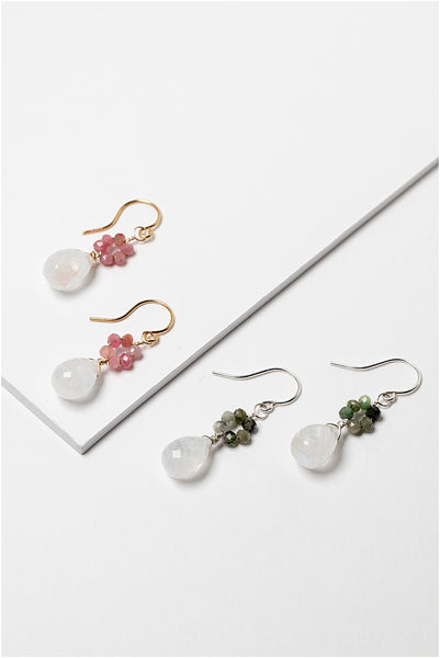 Gold and silver flower power earrings with moonstone drops and tourmaline flowers in pink and green. Handcrafted earrings and custom jewelry by J'Adorn Designs artisan Alison Jefferies