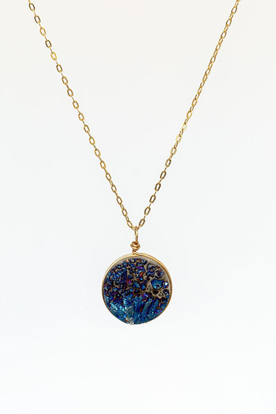Round blue violet druzy gemstone pendant necklace with delicate gold chain. Handcrafted druzy jewelry by J'Adorn Designs jewelry artisan Alison Jefferies