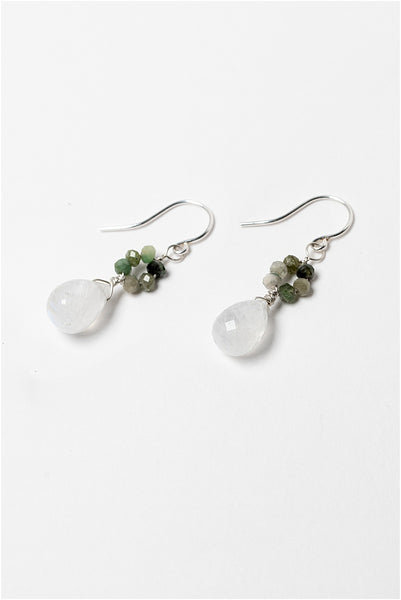 Small silver drop earrings with moonstone teardrops and green tourmaline flowers. Handcrafted earrings and custom jewelry by J'Adorn Designs artisan Alison Jefferies