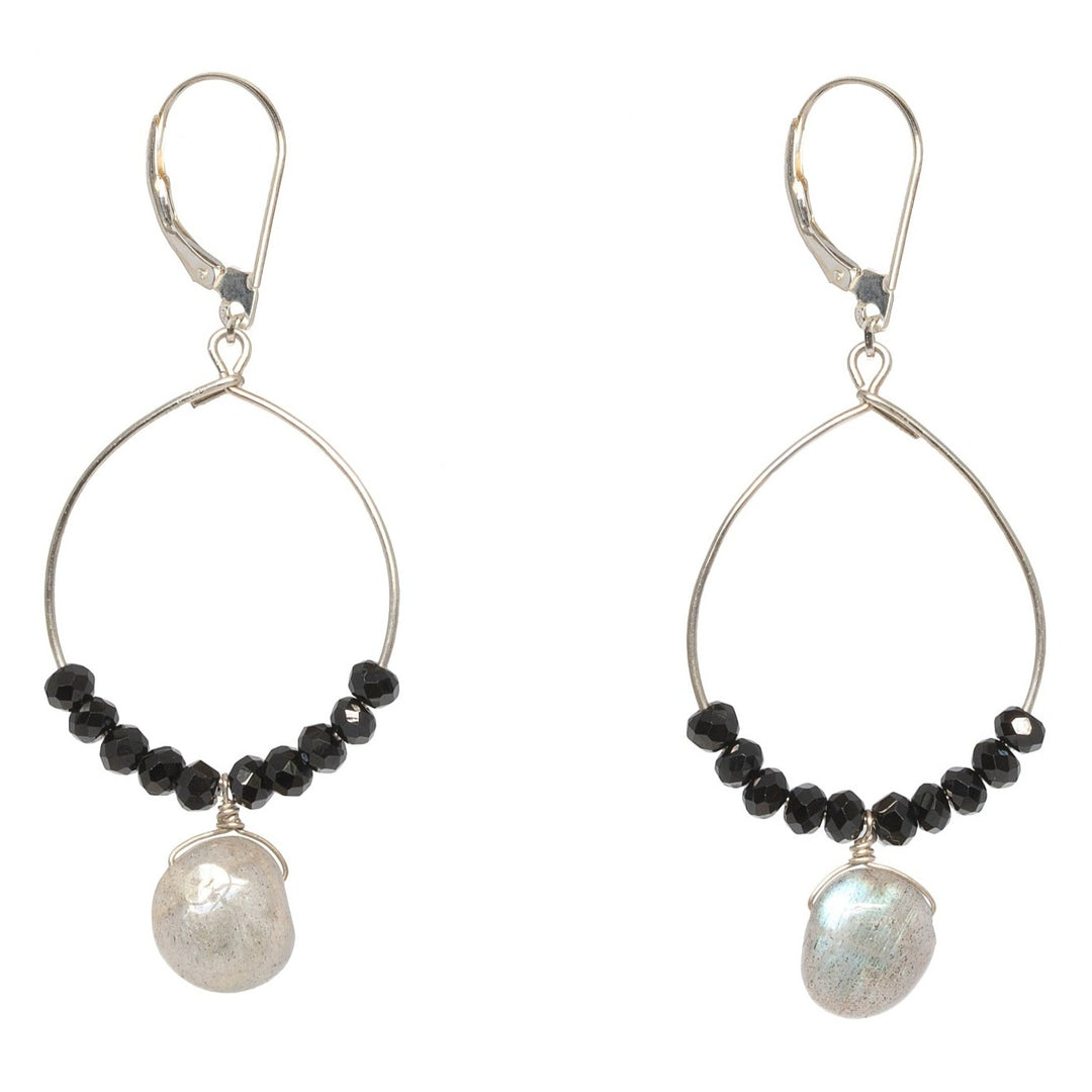 A pair of black and silver hoop earrings with black spinel and iridescent grey labradorite drops. Celestial inspired jewelry for luxury fashion or a jewelry gift idea. Artisan jewelry and luxury bridal accessories handmade in Maryland by Alison Jefferies of J'Adorn Designs.