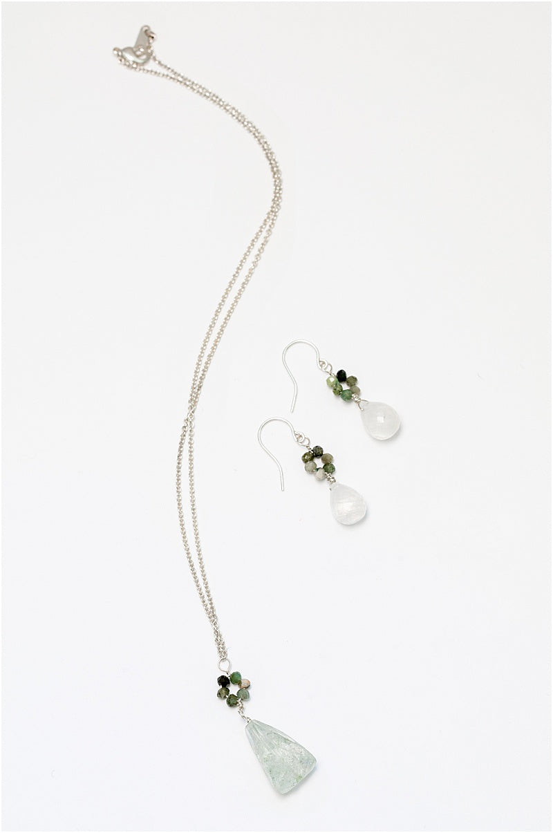 Oceanic pendant necklace in silver with a blue and green "flower" pendant and long light blue faceted drop pendant. Sterling silver necklace in cool ocean colors, handcrafted by J'Adorn Designs artisan Alison Jefferies
