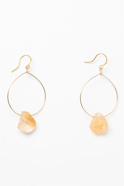 One pair of gold hoop earrings for sale with rough citrine teardrops. 14k gold filled modern hoop earrings for fashion or a jewelry gift idea. Artisan jewelry and luxury bridal accessories handmade in Maryland by Alison Jefferies of J'Adorn Designs.