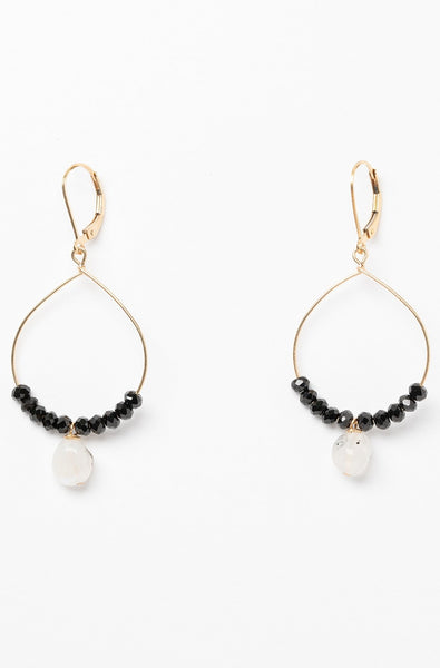 Black and gold handcrafted hoop earrings for sale. A pair of delicate gold hoops with black spinel and moonstone bead accents for luxury fashion or a jewelry gift idea. Artisan jewelry and luxury bridal accessories handmade in Maryland by Alison Jefferies of J'Adorn Designs.