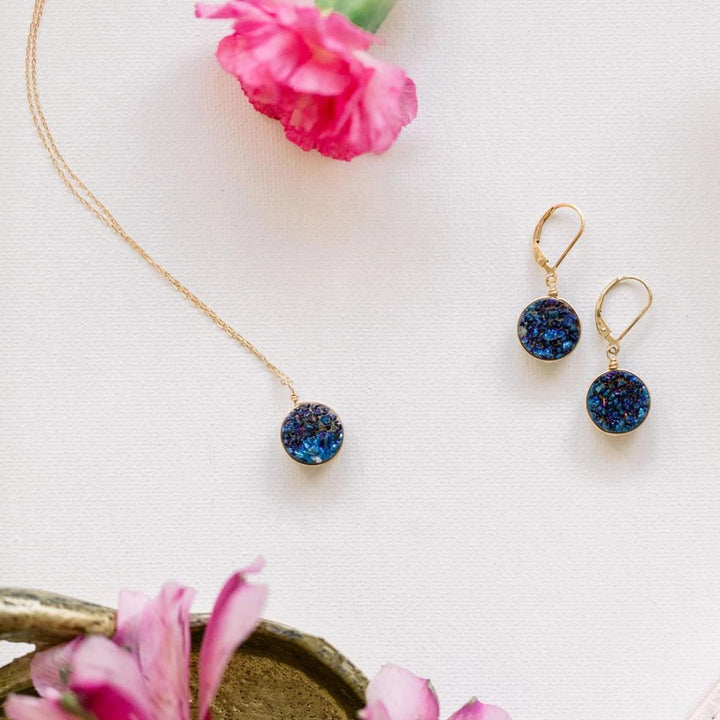 Round blue violet druzy gemstone pendant necklace with delicate gold chain. Handcrafted druzy jewelry by J'Adorn Designs jewelry artisan Alison Jefferies